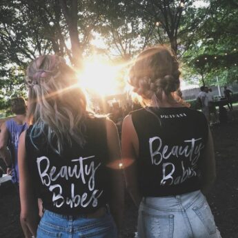 Two females wearing PRAVANA's top that says Beauty Babes on the back