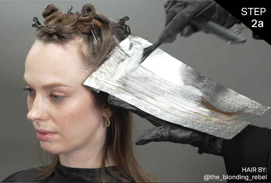 Step 2a: Lightening Formula applied on each side of the head starting 1½” above the ear taking diagonal forward partings