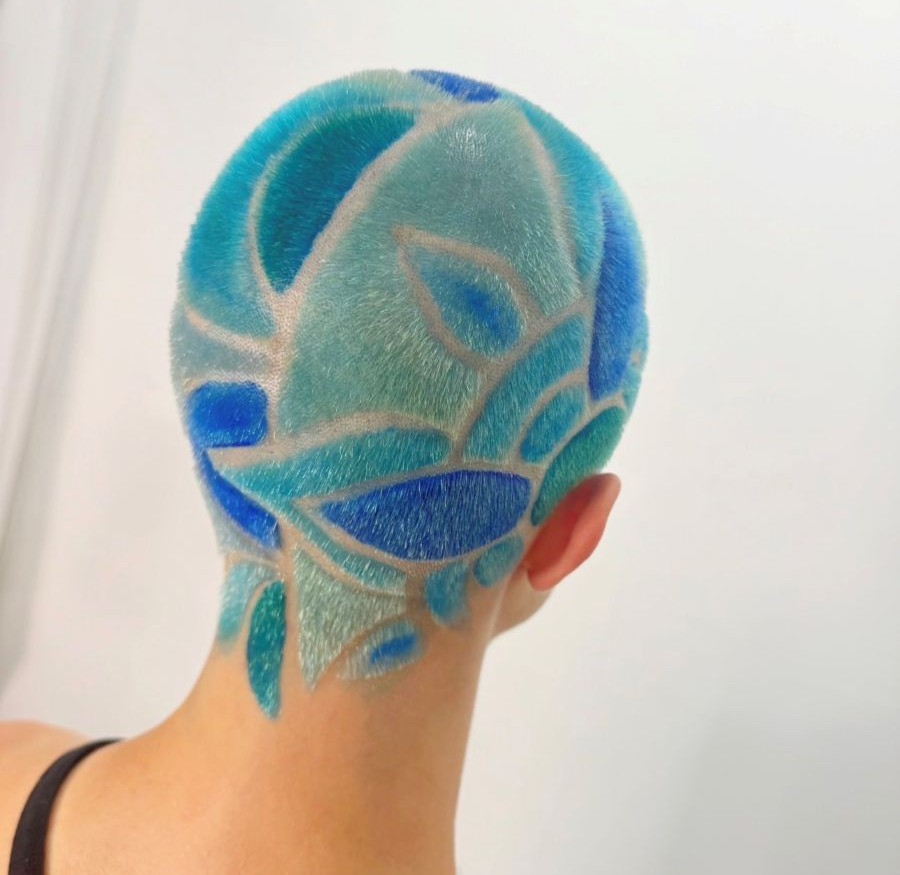 Hair tattoo design featuring geometric patterns filled with shades of blue created with PRAVANA ChromaSilk VIVIDS.