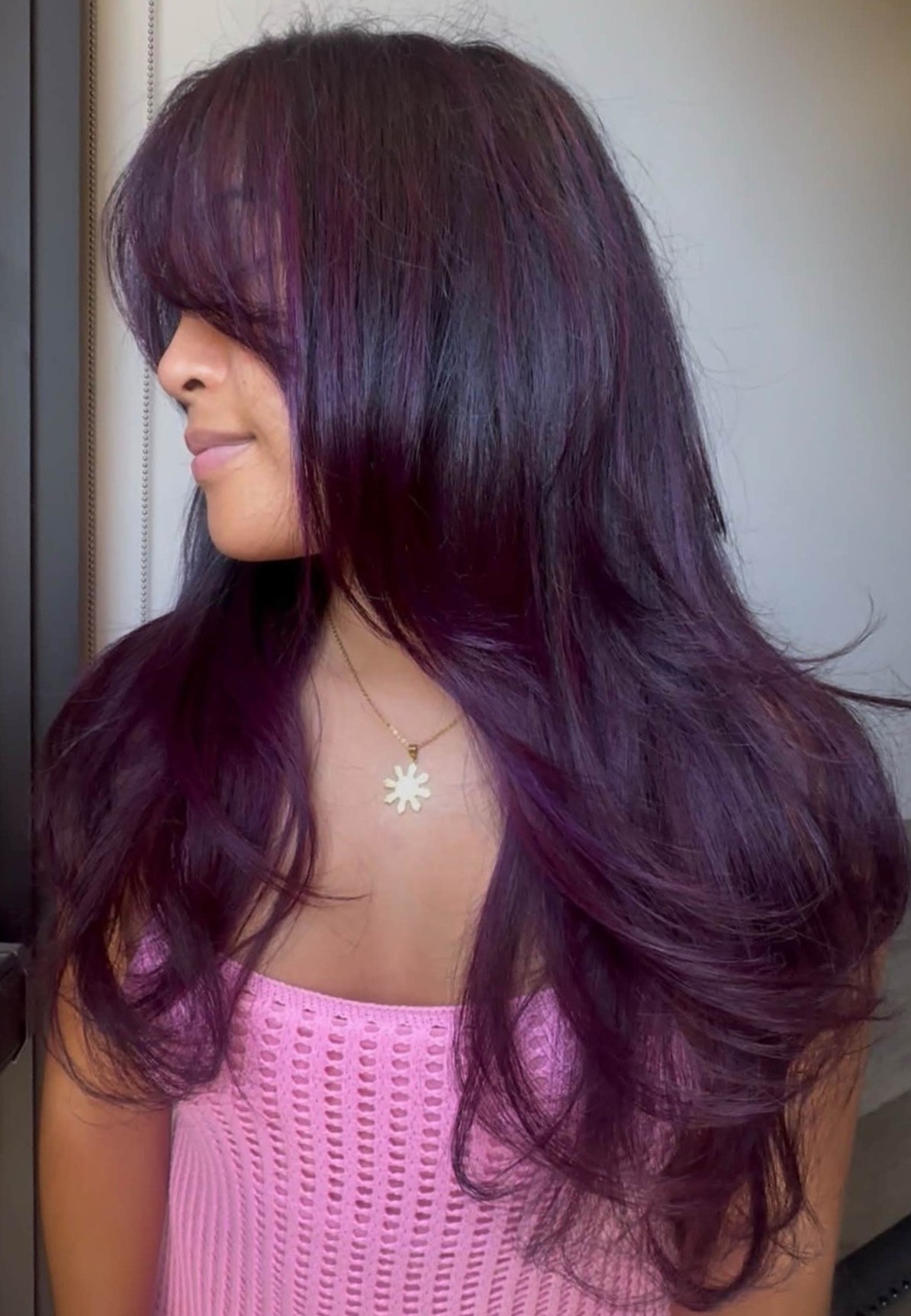 Bright shiny jewel-toned amethyst purple hair, bold fashion color for fall.