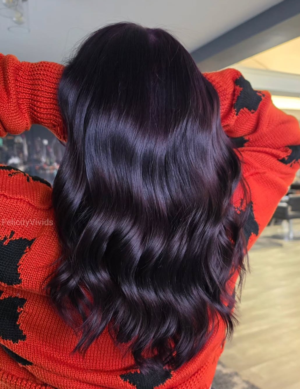 Deep dark blackberry hair color with high shine and subtle violet tones visible in the light, a wearable dark purple fall hair color.