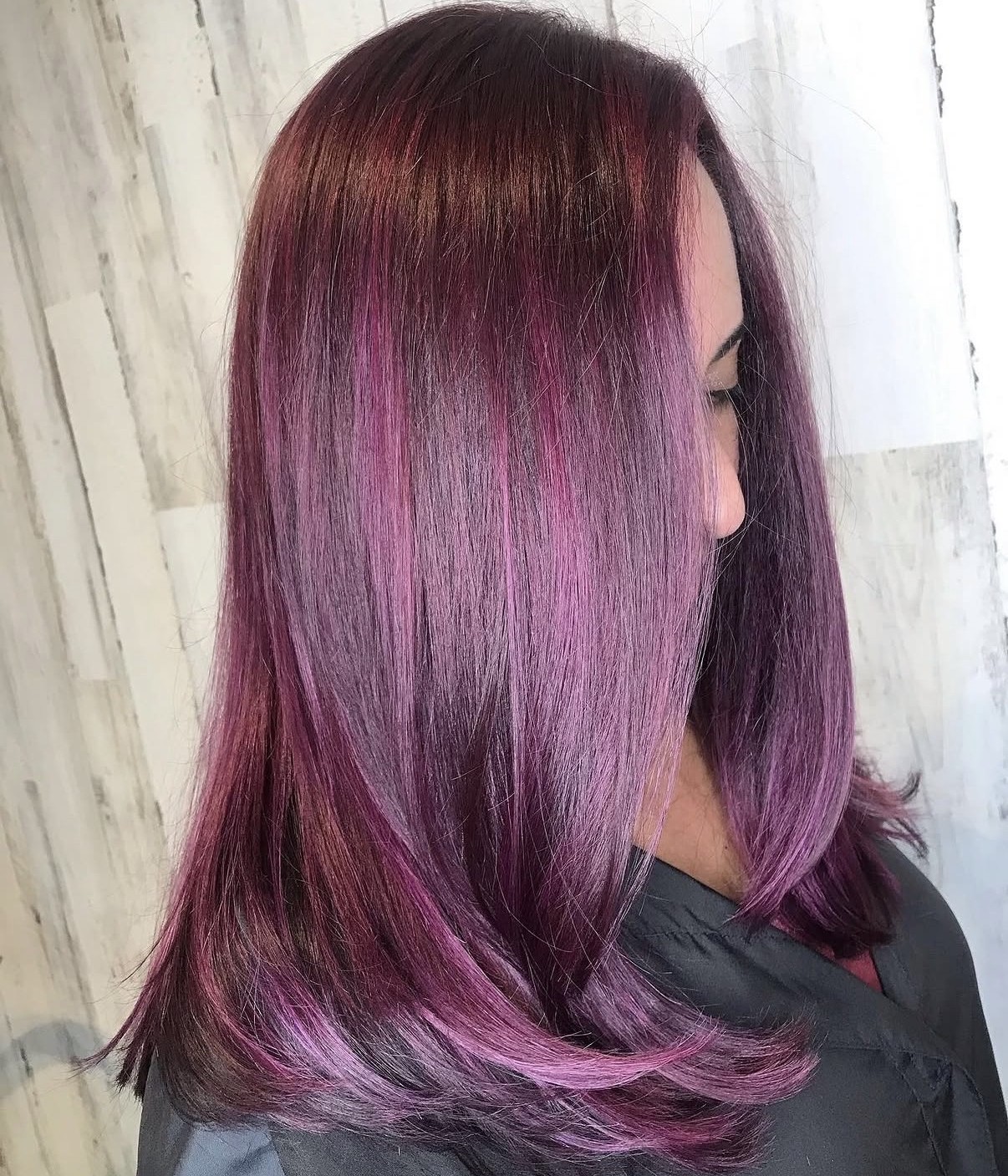 Deep vibrant plum hair color created with PRAVANA ChromaSilk VIVIDS Everlasting, showcasing rich jewel-toned violet with glossy permanent fashion color shine.