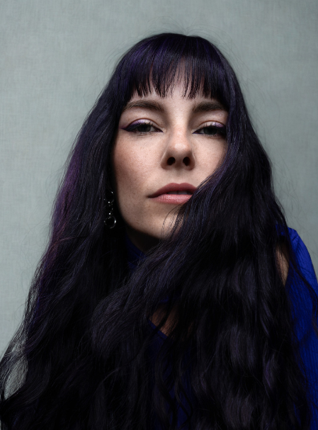 A moody rich plum hair color created with permanent hair color only, a sophisticated purple fall hair color.
