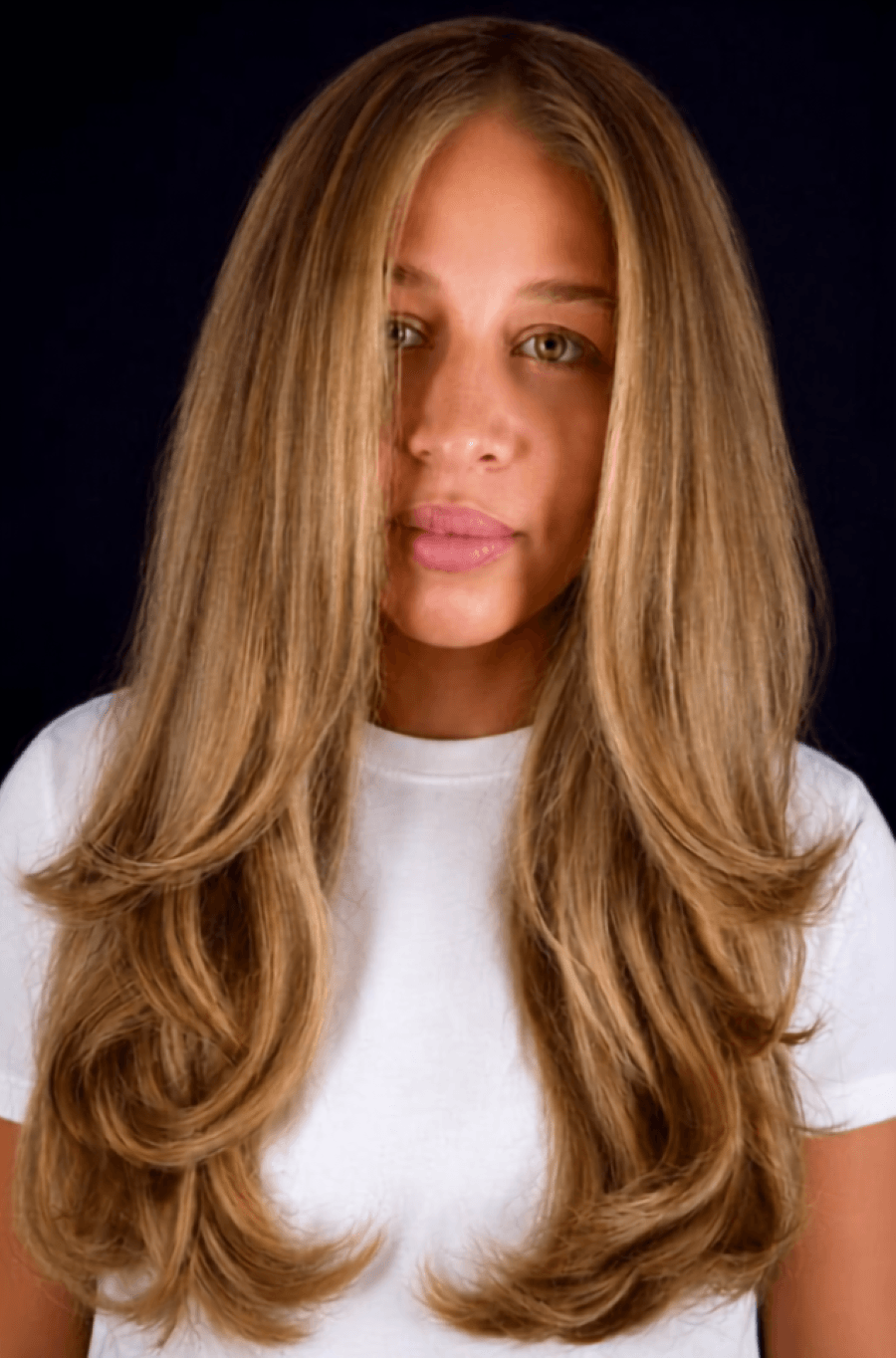 Vibrant, amber-gold blonde tones against rich brunette depth create a Butterscotch Blonde.